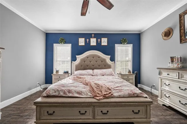 a bedroom with a bed and dresser