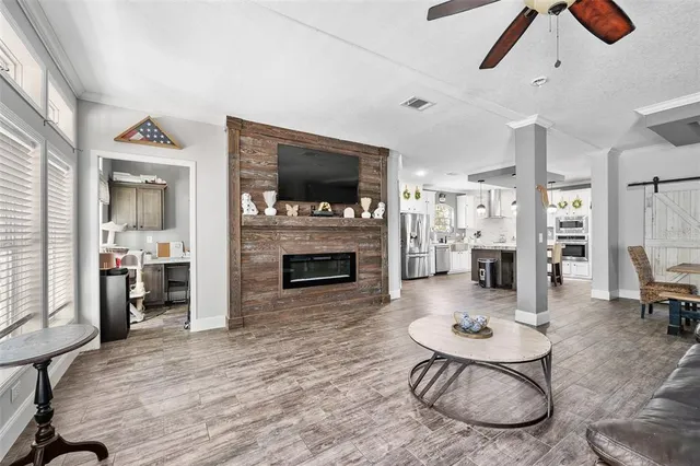 a living room with furniture and a fireplace