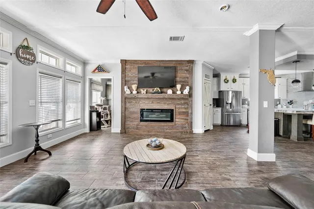 a living room with furniture and a fireplace