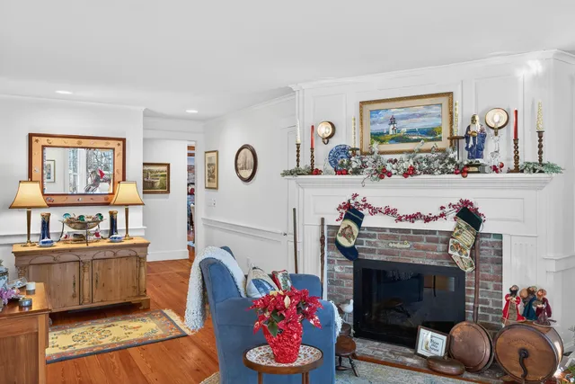 a living room with furniture a window and fireplace