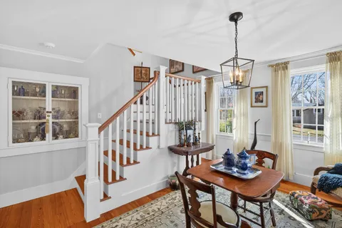 a view of a livingroom with furniture window and wooden floor