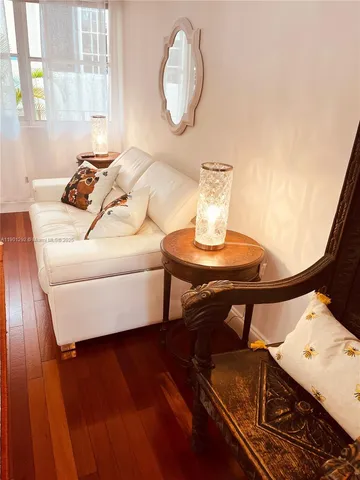 a living room with chair and a table