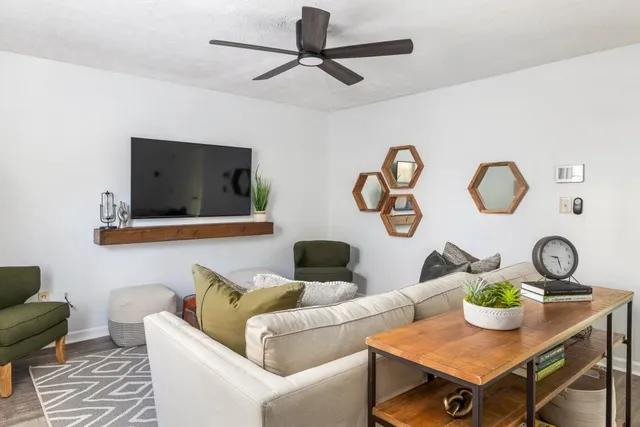 a living room with furniture and window