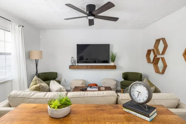 a living room with furniture and a window