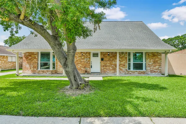 front view of a house with a yard