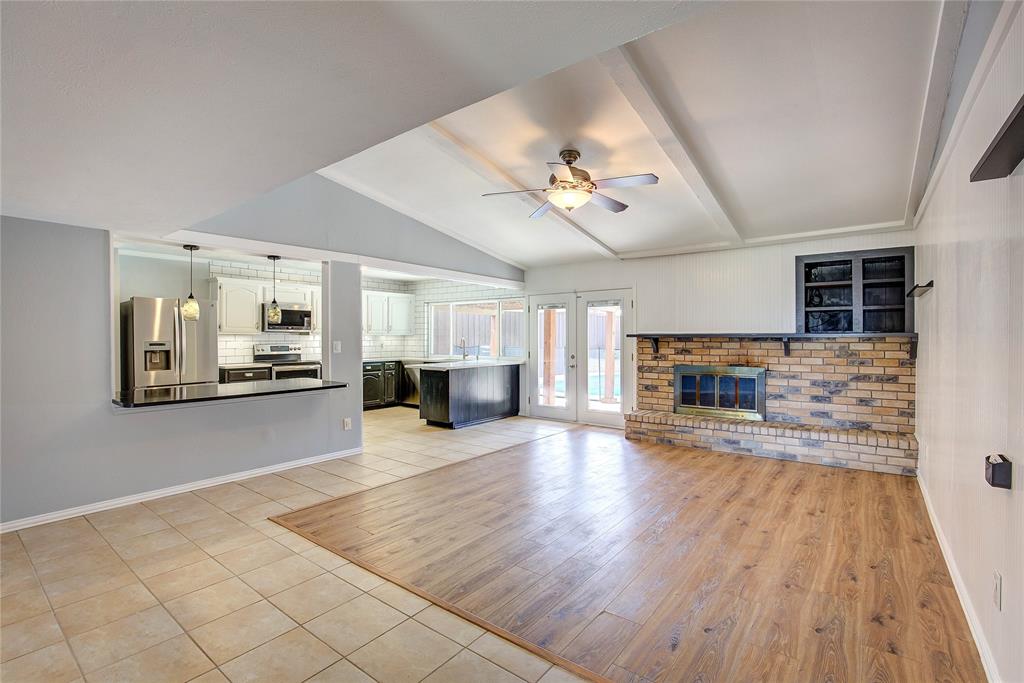 5233 Reed Drive The Colony, TX 75056 - Photo 15 of 40 a living room with furniture and a fireplace