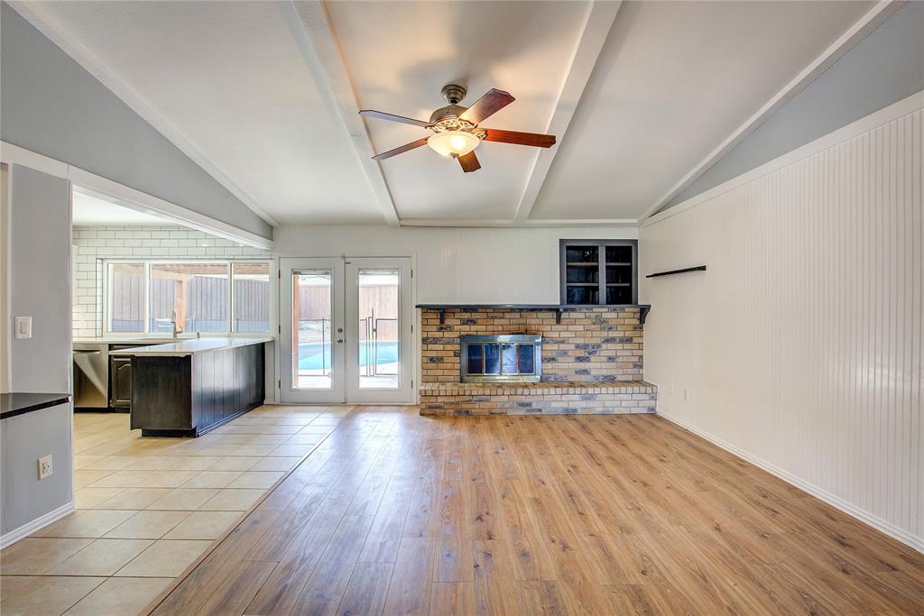 5233 Reed Drive The Colony, TX 75056 - Photo 10 of 40 a view of a living room a flat screen tv and windows