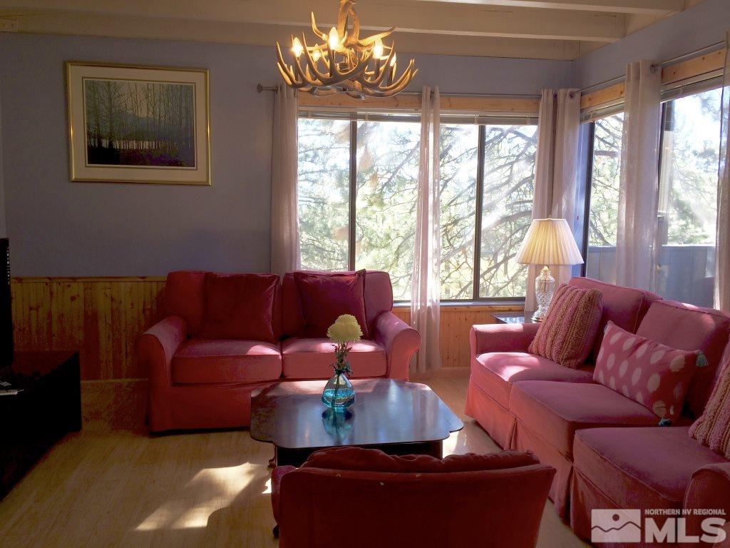 233 Clubhouse Circle Stateline, NV 89449 - Photo 1 of 28 a living room with furniture and a large window