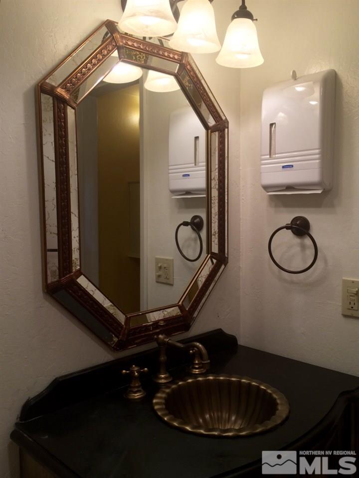 233 Clubhouse Circle Stateline, NV 89449 - Photo 14 of 28 a bathroom with a sink a mirror and a shower