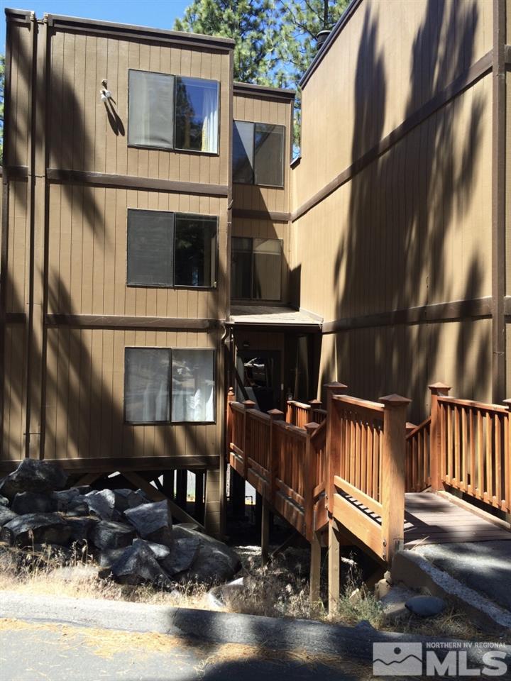 233 Clubhouse Circle Stateline, NV 89449 - Photo 2 of 28 a view of a house with a wooden deck