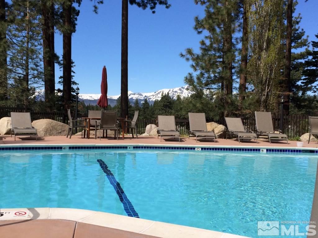 233 Clubhouse Circle Stateline, NV 89449 - Photo 24 of 28 a view of swimming pool with outdoor seating and plants