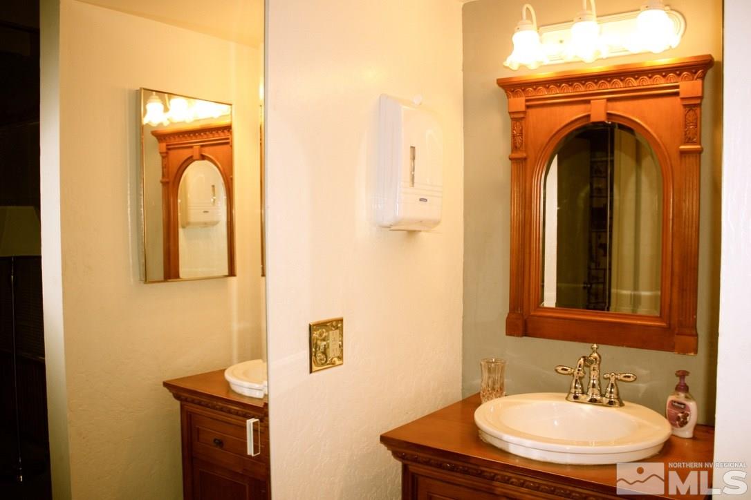 233 Clubhouse Circle Stateline, NV 89449 - Photo 3 of 28 a bathroom with a sink and a mirror