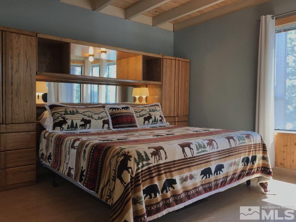 233 Clubhouse Circle Stateline, NV 89449 - Photo 6 of 28 a bed sitting in a bedroom next to a window