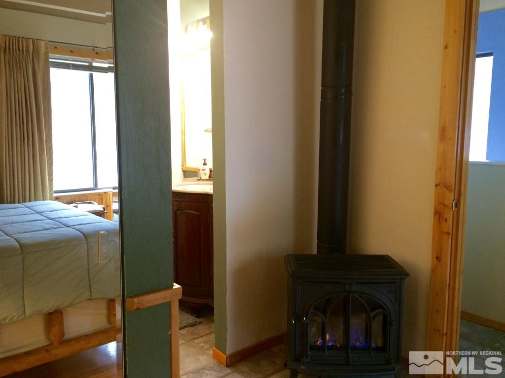 233 Clubhouse Circle Stateline, NV 89449 - Photo 10 of 28 a bedroom with a bed and a window