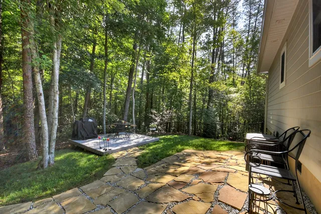 a view of a backyard with sitting area