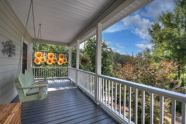 a view of a balcony with wooden floor