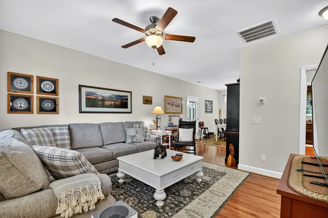 a living room with furniture and a rug