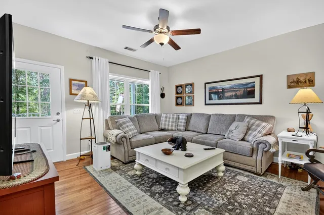 a living room with furniture a bed and a couch