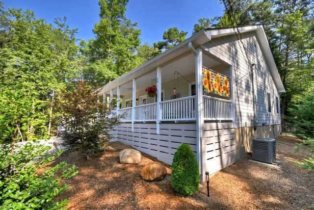 a pathway of a house with a yard