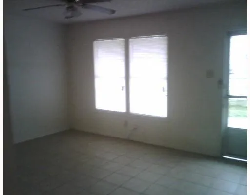 a bathroom with a tub and shower