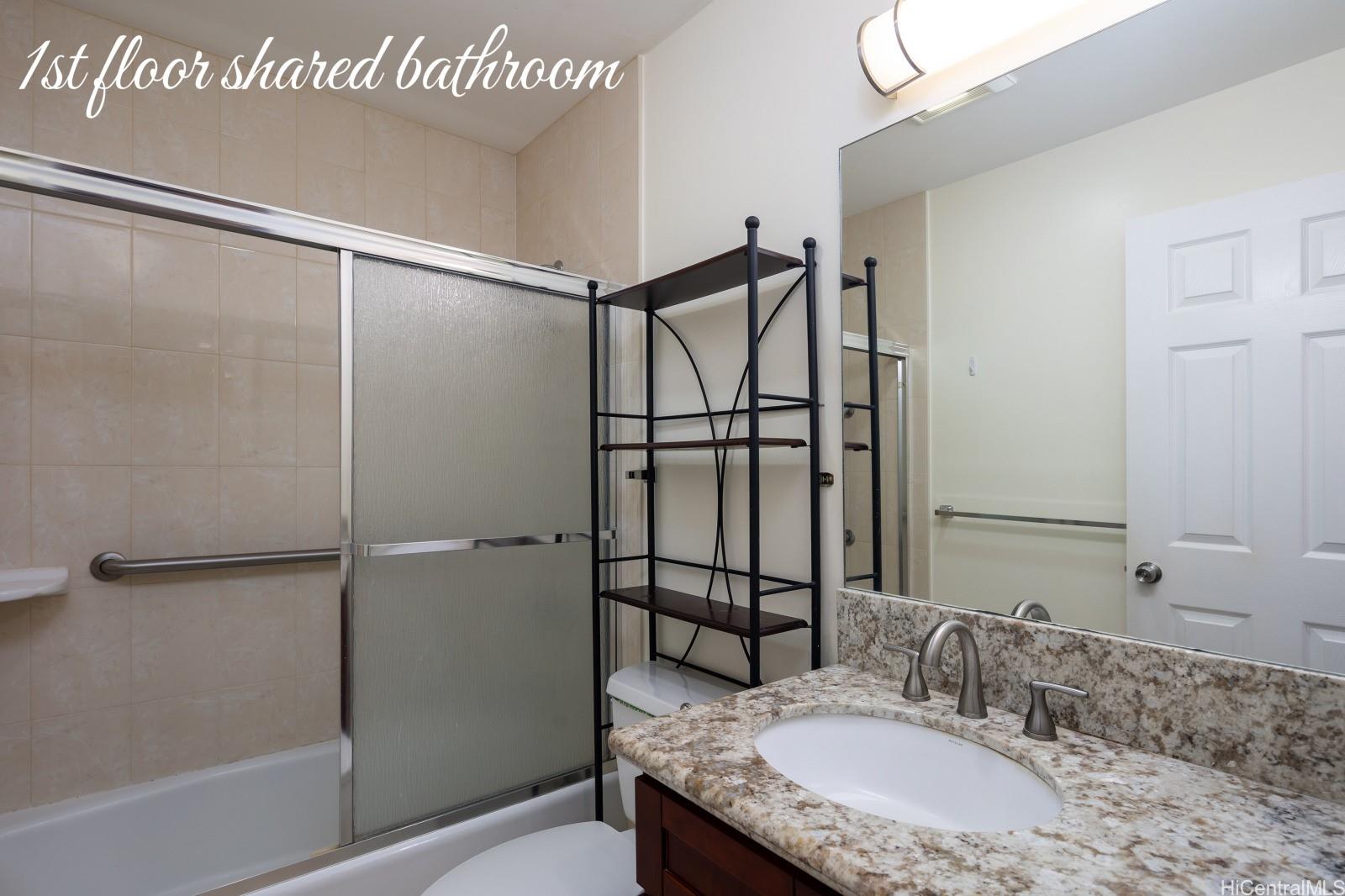 841 20th Avenue Honolulu, HI 96816 - Photo 5 of 8 a bathroom with a granite countertop shower sink and mirror