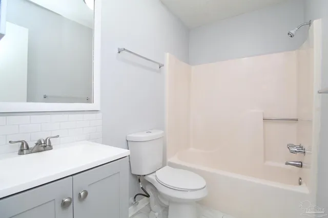 a bathroom with a sink a toilet and a bathtub