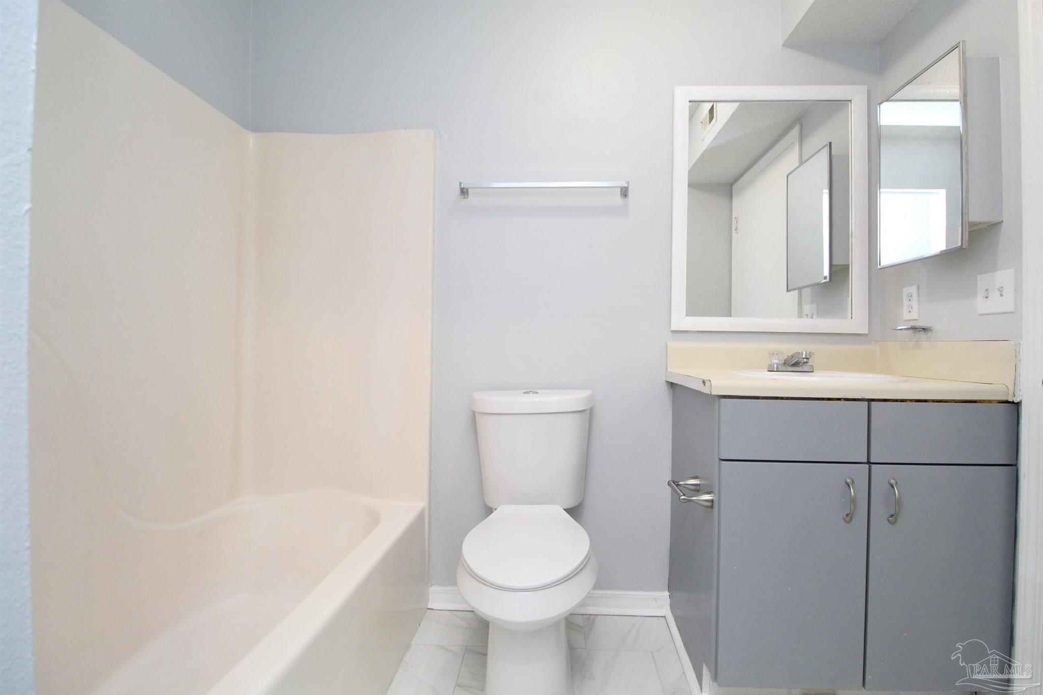 7116 Pearson Road, Unit C Pensacola, FL 32526 - Photo 17 of 20 a bathroom with a sink toilet and shower