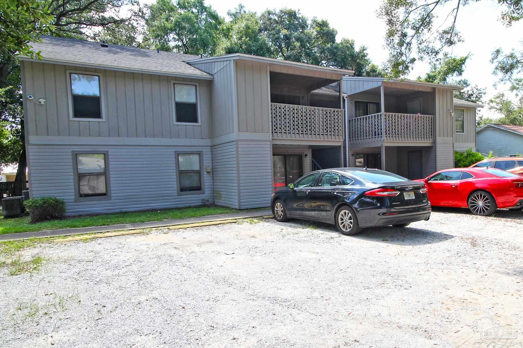 7116 Pearson Road, Unit C Pensacola, FL 32526 - Photo 2 of 20 a car parked in front of a house