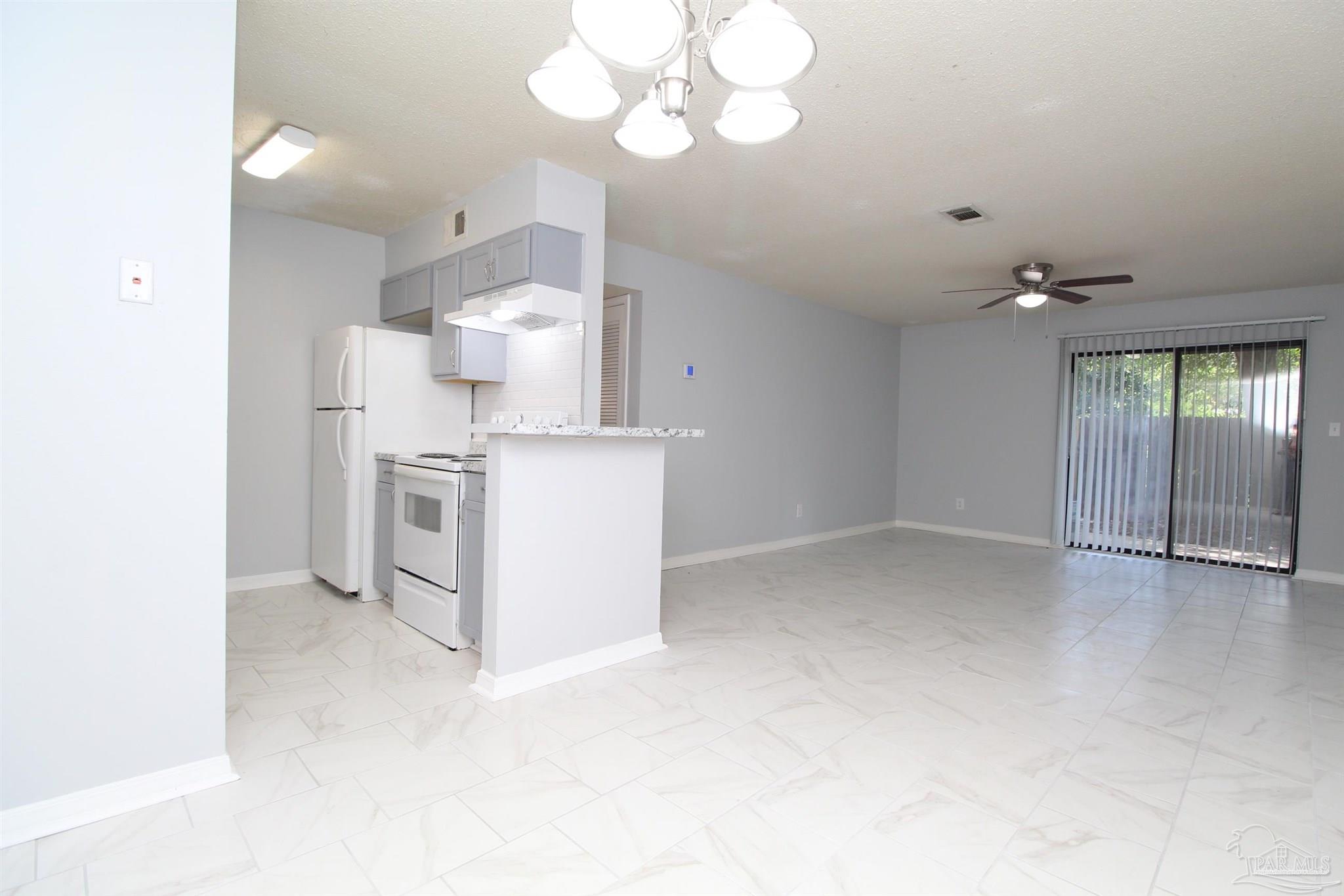 7116 Pearson Road, Unit C Pensacola, FL 32526 - Photo 6 of 20 a view of cabinets and window