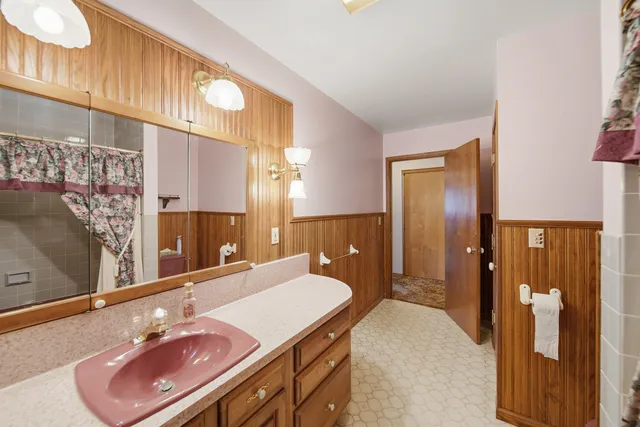 a view of an empty room with windows