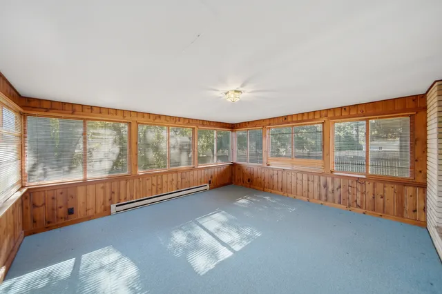 a kitchen with stainless steel appliances granite countertop a sink dishwasher and a stove with wooden floor