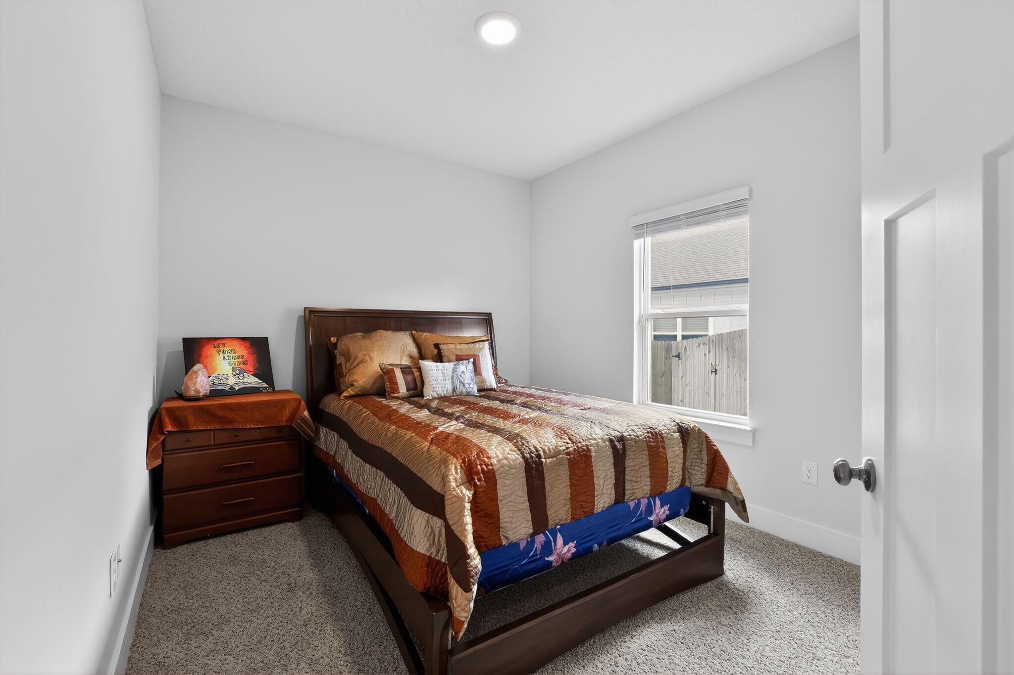 2452 Dakota Way Crestview, FL 32536 - Photo 22 of 24 a bedroom with a bed and a window