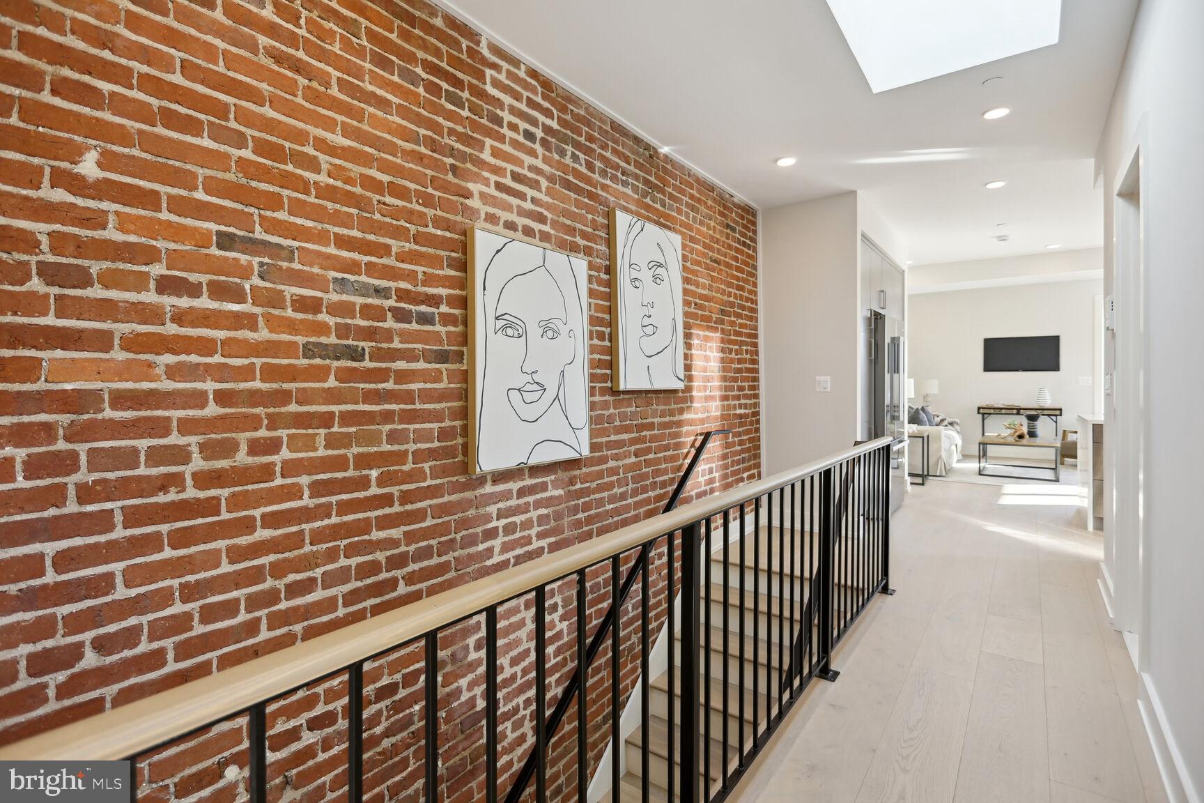 1746 Lanier Place Northwest, Unit 3 Washington, DC 20009 - Photo 4 of 34 Entry with Exposed Brick Wall