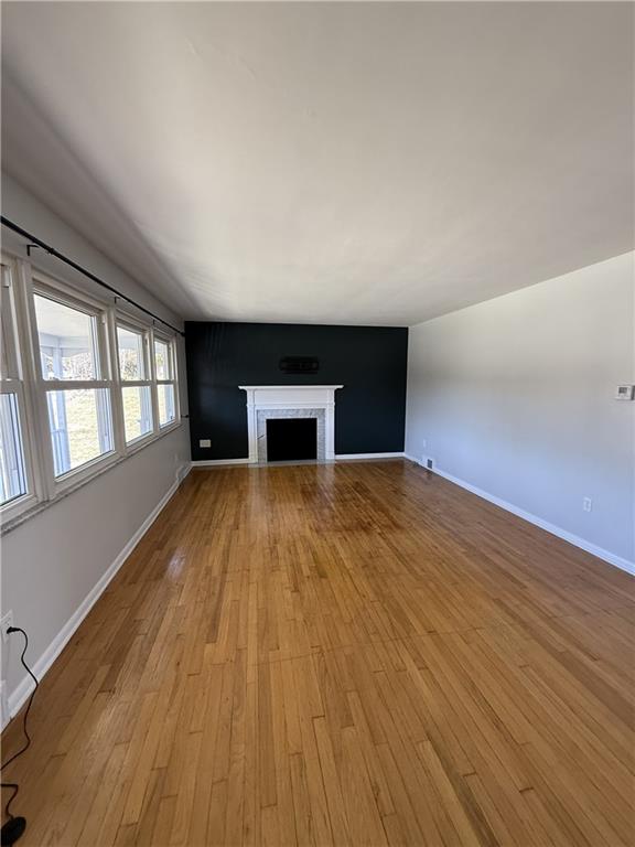 1681 Robbins Station Road Irwin, PA 15642 - Photo 12 of 27 a view of empty room with wooden floor and fan