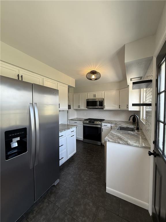 1681 Robbins Station Road Irwin, PA 15642 - Photo 13 of 27 a kitchen with a refrigerator stove and sink