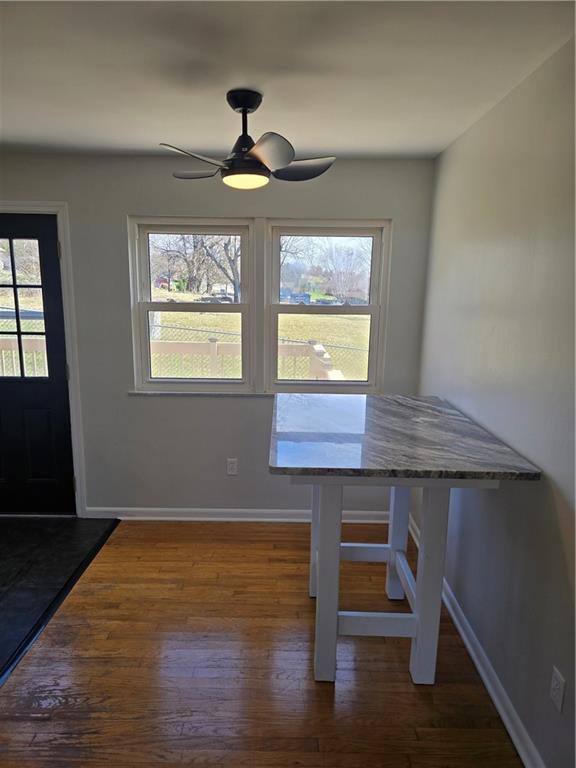 1681 Robbins Station Road Irwin, PA 15642 - Photo 17 of 27 a room with chandelier fan wooden floor and windows