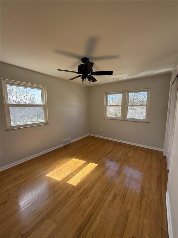 1681 Robbins Station Road Irwin, PA 15642 - Photo 18 of 27 a view of empty room with wooden floor and fan