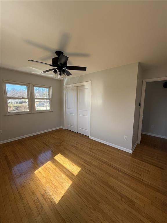 1681 Robbins Station Road Irwin, PA 15642 - Photo 19 of 27 a view of empty room with wooden floor and fan