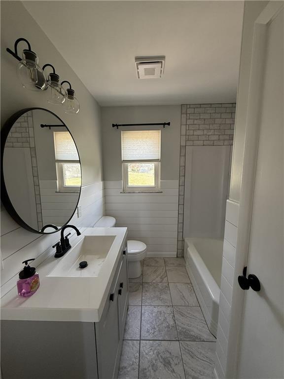 1681 Robbins Station Road Irwin, PA 15642 - Photo 23 of 27 a bathroom with a sink mirror and toilet