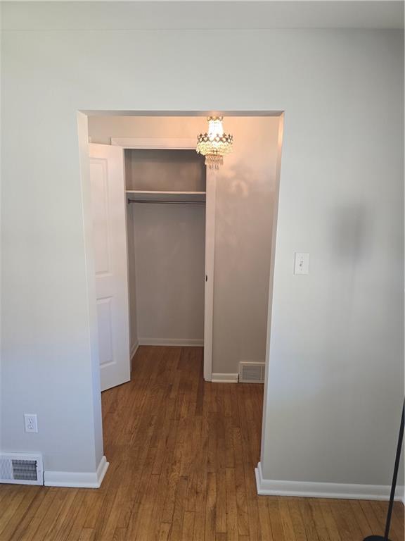 1681 Robbins Station Road Irwin, PA 15642 - Photo 9 of 27 an empty room with wooden floor and closet