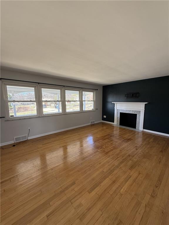 1681 Robbins Station Road Irwin, PA 15642 - Photo 10 of 27 a view of empty room with wooden floor and fireplace