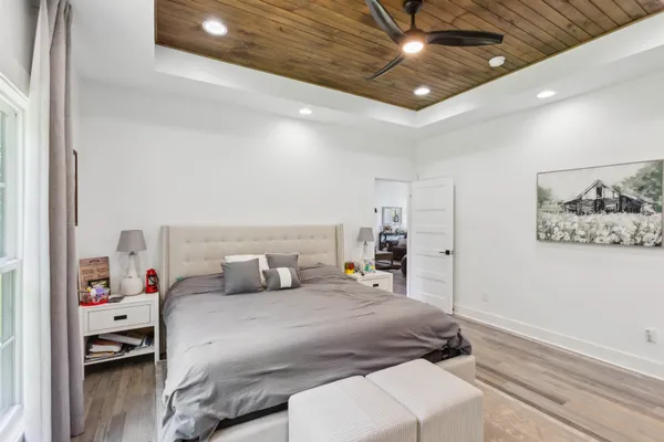 a bedroom with a bed and a walk in closet