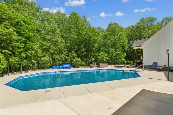 a view of a swimming pool and an outdoor space