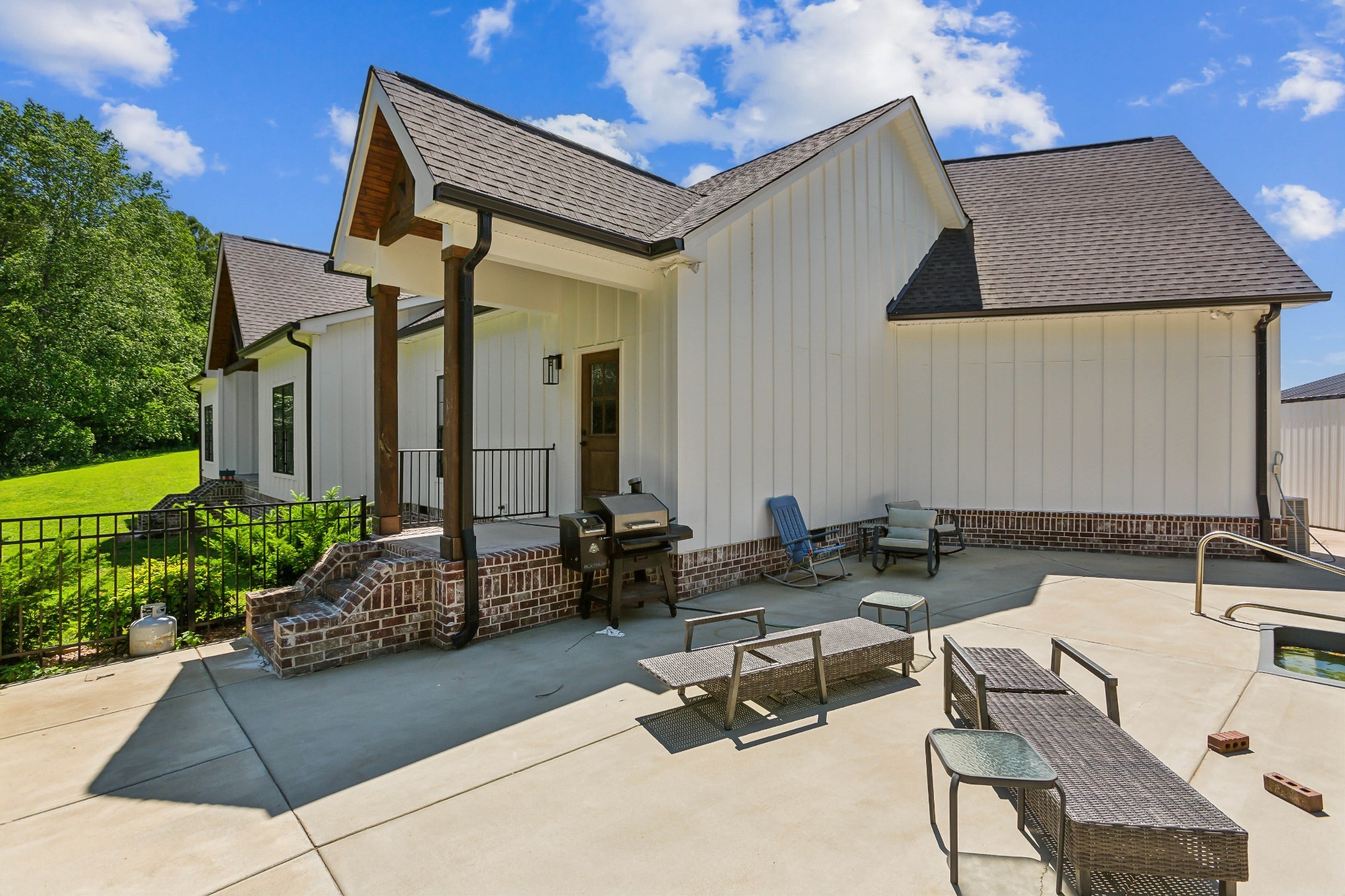 1930 Williams Road Lafayette, TN 37083 - Photo 39 of 41 a building outdoor space with patio furniture and potted plants