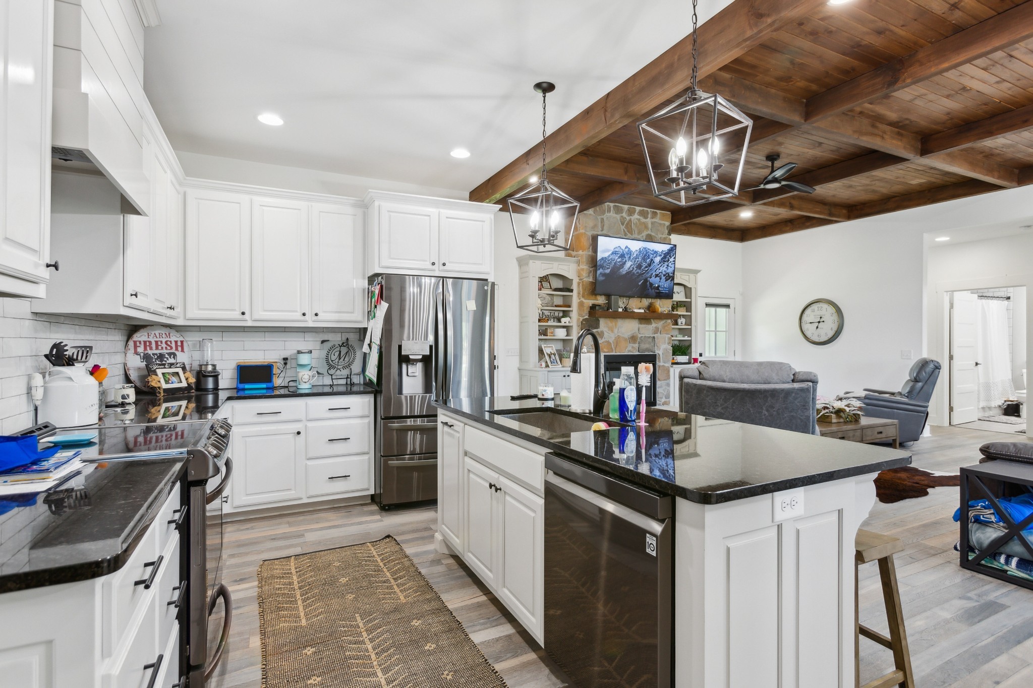 1930 Williams Road Lafayette, TN 37083 - Photo 9 of 41 a kitchen with kitchen island granite countertop a sink counter top space appliances and cabinets