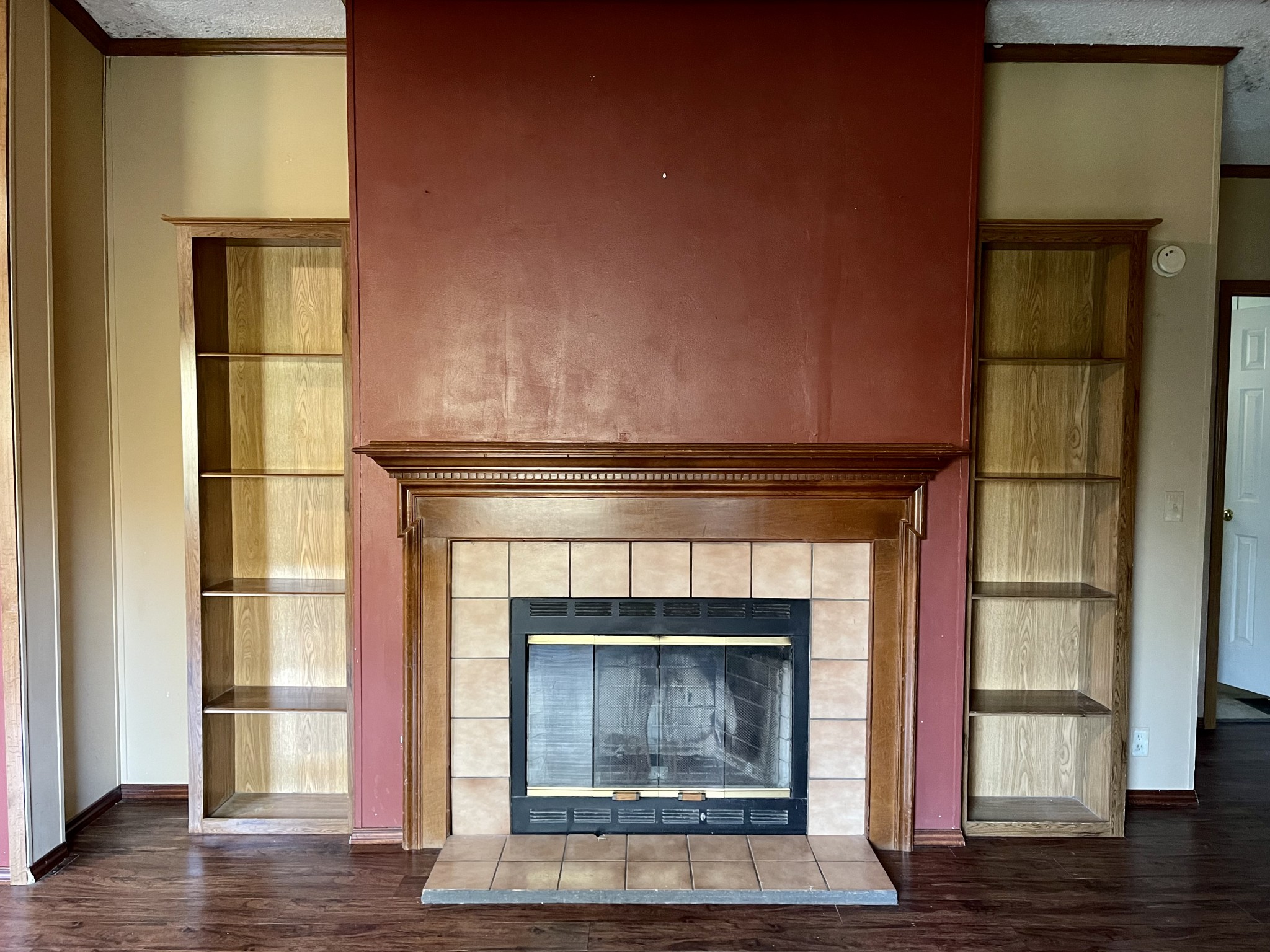 274 Hester Road Portland, TN 37148 - Photo 18 of 18 a fireplace with a wooden floor