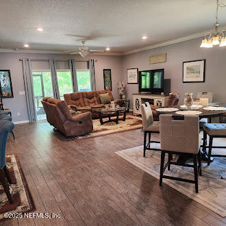 221 St Kitts Loop St. Augustine, FL 32092 - Photo 13 of 44 a living room with furniture wooden floor and a large window