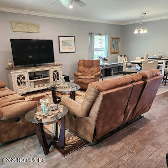 221 St Kitts Loop St. Augustine, FL 32092 - Photo 14 of 44 a living room with furniture and a flat screen tv