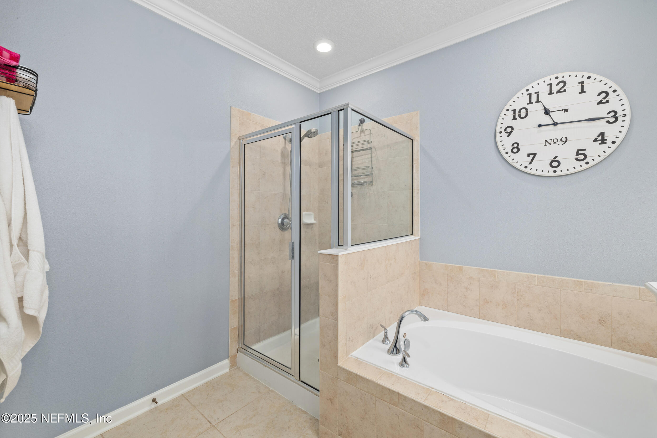 221 St Kitts Loop St. Augustine, FL 32092 - Photo 17 of 44 a bathroom with a bathtub and a shower