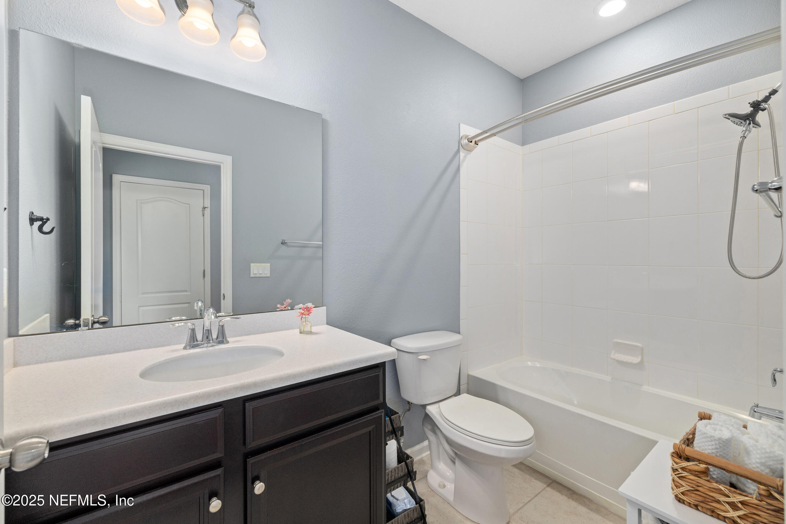 221 St Kitts Loop St. Augustine, FL 32092 - Photo 20 of 44 a bathroom with a sink a toilet and shower